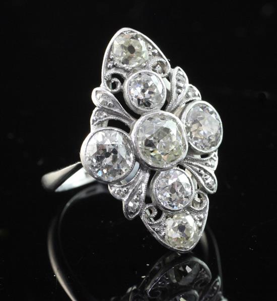 An early 20th century 18ct white gold and platinum, diamond cluster ring, size